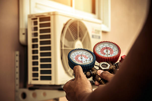 Professional Air Conditioning Service technician working in Kansas City, KS